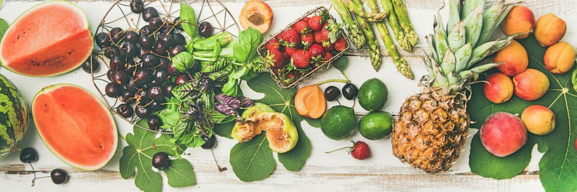 Assorted fresh fruits and vegetables on table.