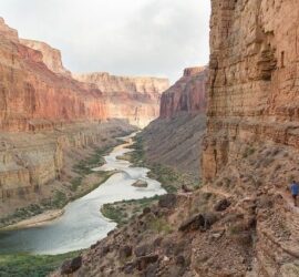 Canyon landscape with river and hiking trail.