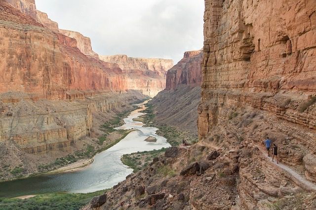 Canyon landscape with river and hiking trail.