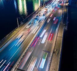 Long exposure of city traffic at night creating vibrant light trails.