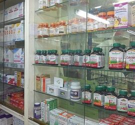 Pharmacy shelves with various health supplements.